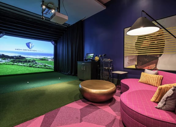 a game room with a pink couch and a large window at Altis Grand Kendall, Miami, 33186