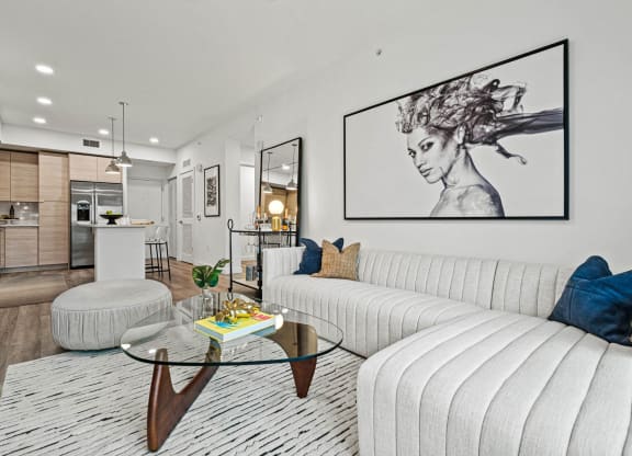 a living room with a white couch and lights on the wall at Altis Grand Kendall, Miami Florida