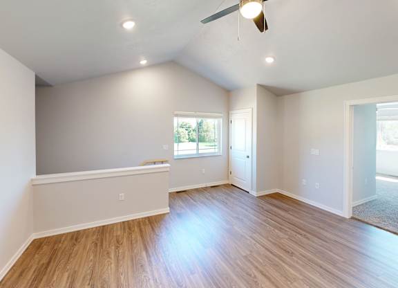 A room with wooden floors and white walls.