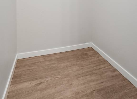 A room with a slanted ceiling and a slanted wall.