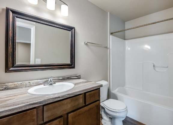 Well-Lit Bathroom with Tub