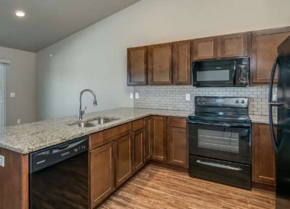 Kitchen with Granite Countertops and Open Concept Living Area