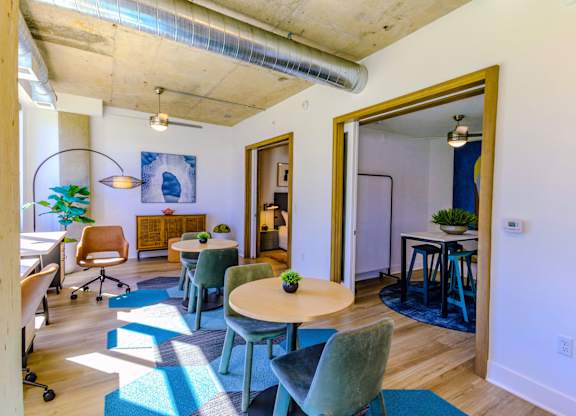 A room with a table and chairs.