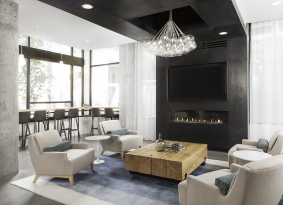 4730 California Apartments The Junction Room with Seating and Television