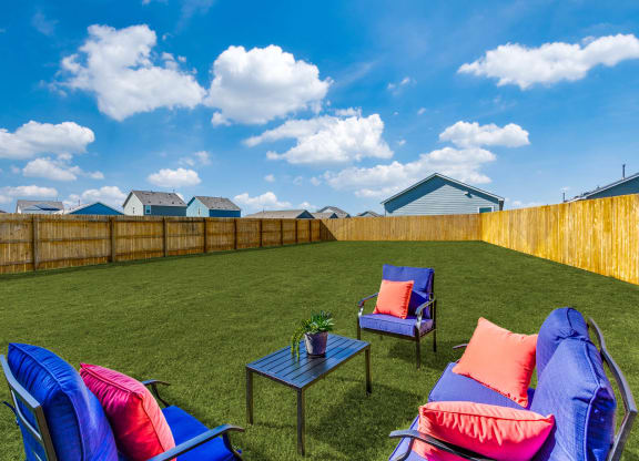 Linea Stillwater Rental Homes Backyard Lawn with Patio Furniture