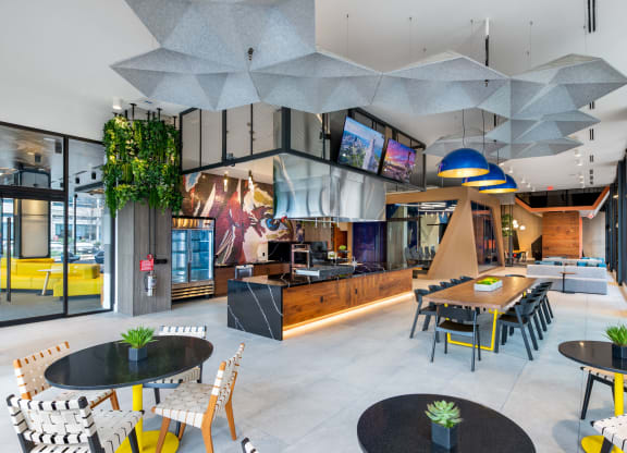 the lobby of a restaurant with tables and chairs