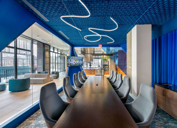 a conference room with a long table and chairs