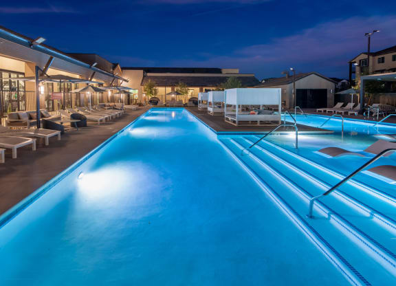 a swimming pool at night at the resort at night