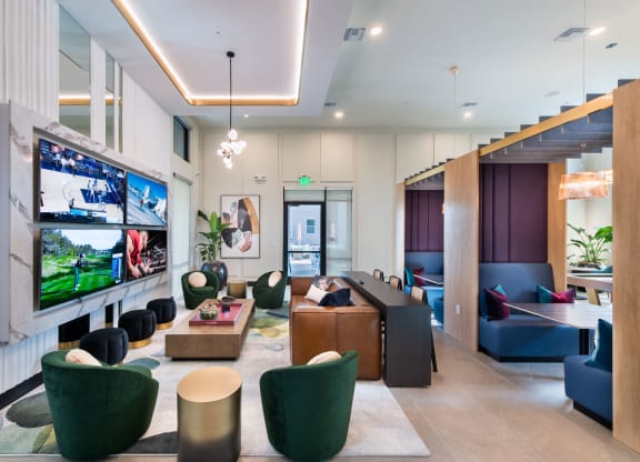 a living room with furniture and a large tv