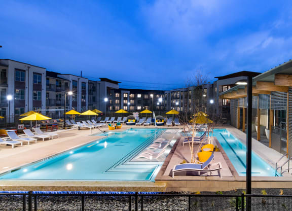Corsair Apartments Pool with Lounge Chairs