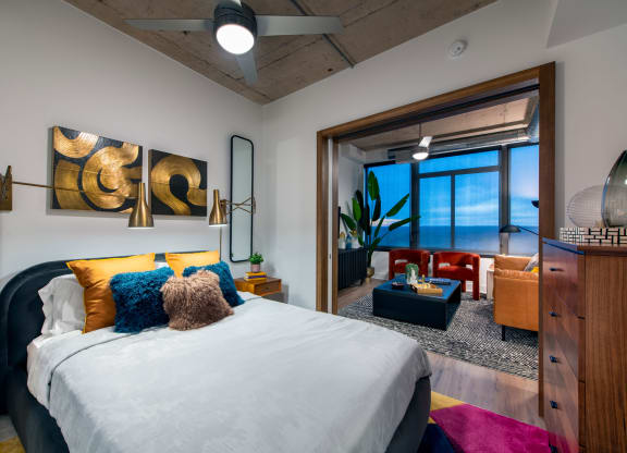 a bedroom with a large bed and a large window