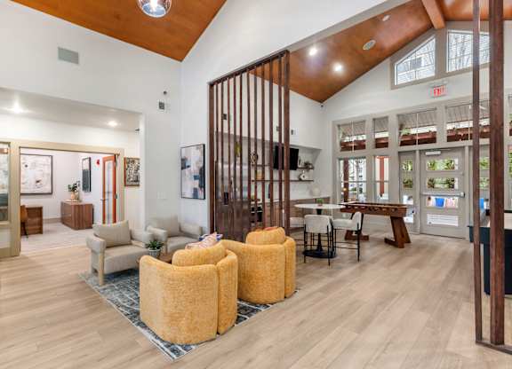 A modern interior with wooden floors and furniture.