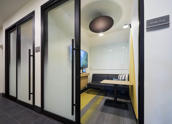 a conference room with a table and a couch