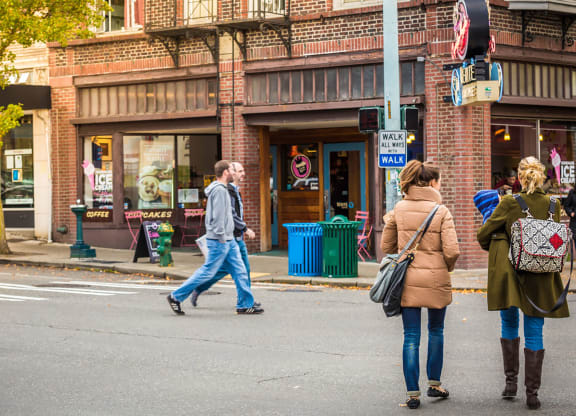 Group of People Walking in Downtown West Seattle Intersection