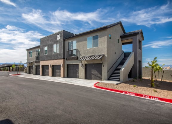 a new building with stairs and a parking lot