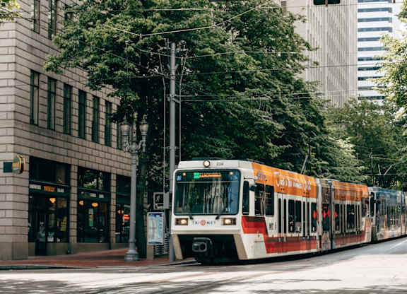 a train on the street in a city
