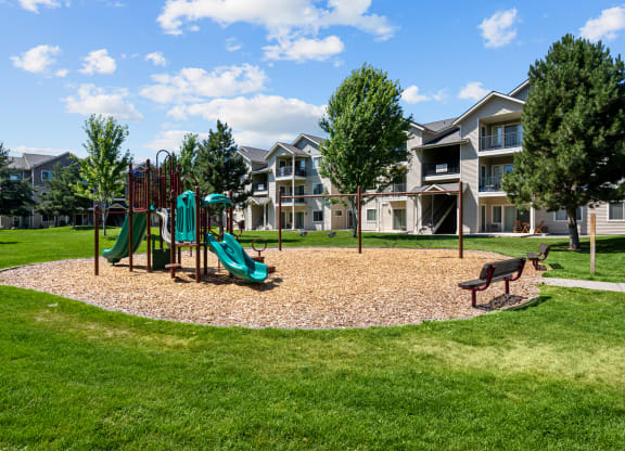 the preserve at ballantyne commons playground with play equipment and apartments in the background