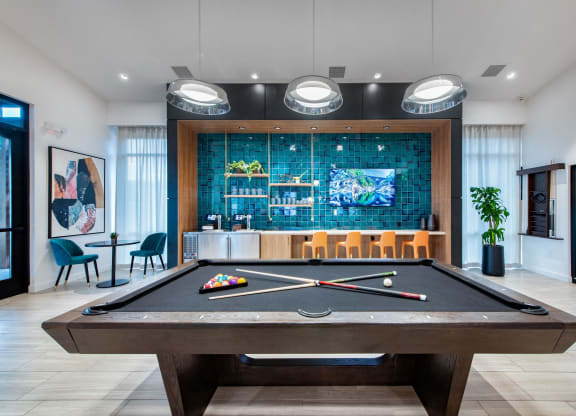 play a game of pool in our clubhouse at our apartments