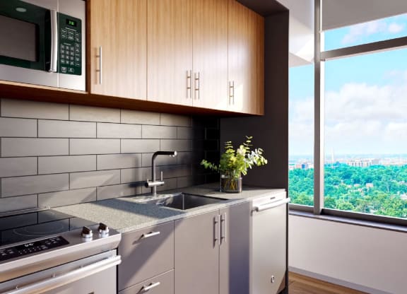 a kitchen with a stove and a sink next to a window