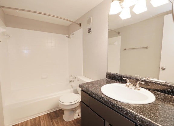 a bathroom with a sink toilet and bathtub