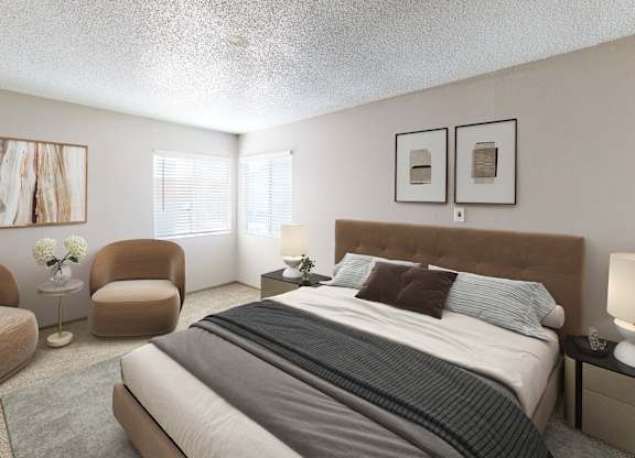 A bedroom with a large bed, two chairs, and a nightstand.