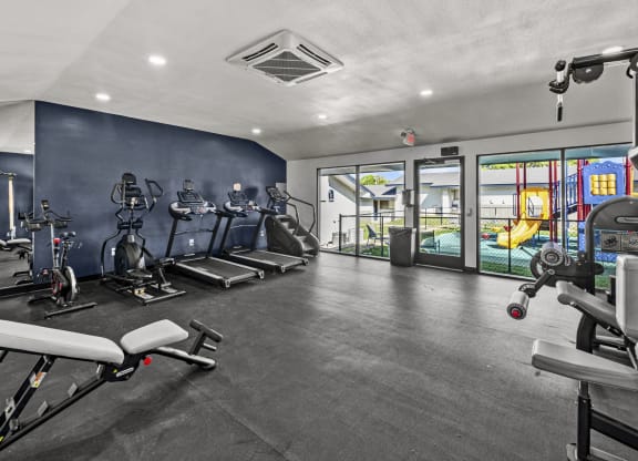 a gym with exercise equipment at Peaks at Live Oak in San Antonio, TX