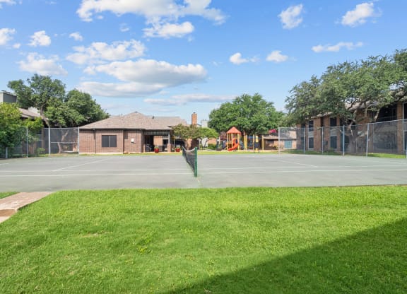 a tennis court at legacy apartments in plano, tx