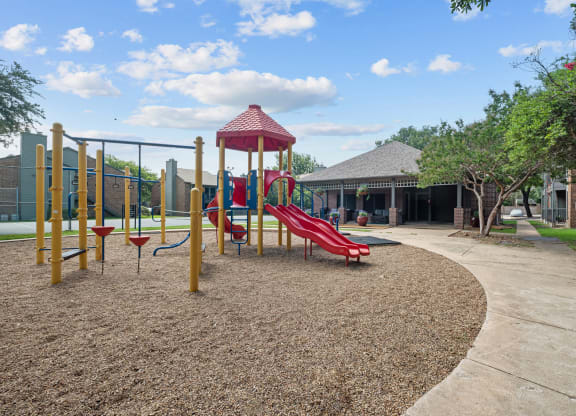 a playground at legacy apartments in plano, tx