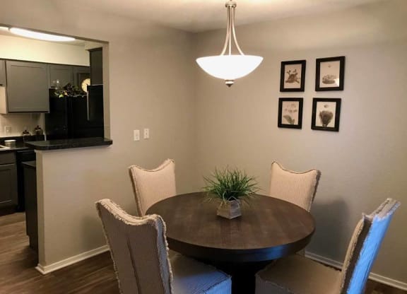 a dining room with a table and chairs