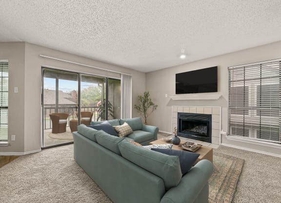 a living room with a couch and a fireplace