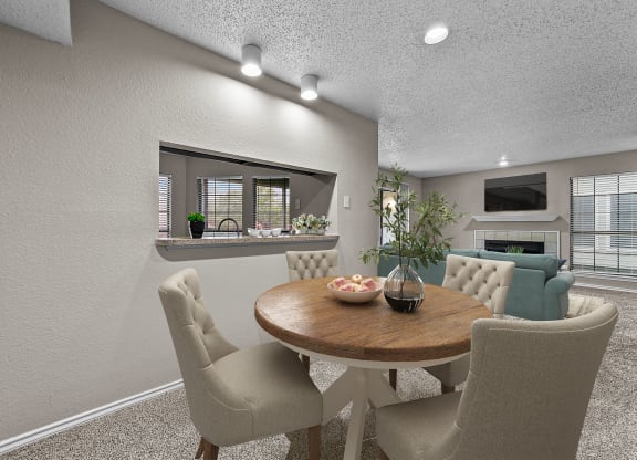 a dining room with a table and chairs