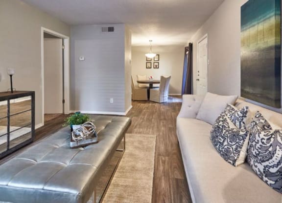 a living room with a couch and a table in the background