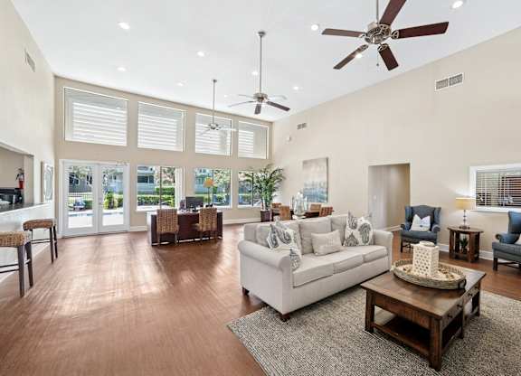 A living room with a white couch and a coffee table.
