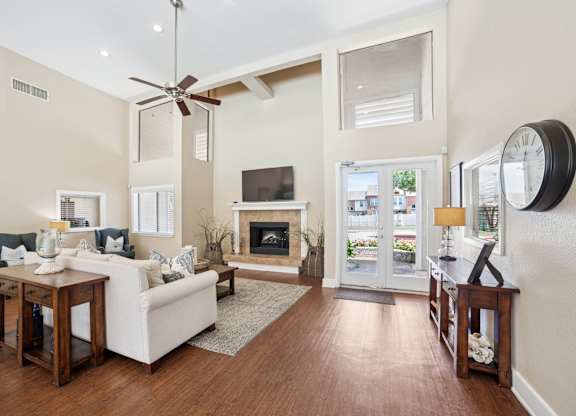 A living room with a fireplace and a television.