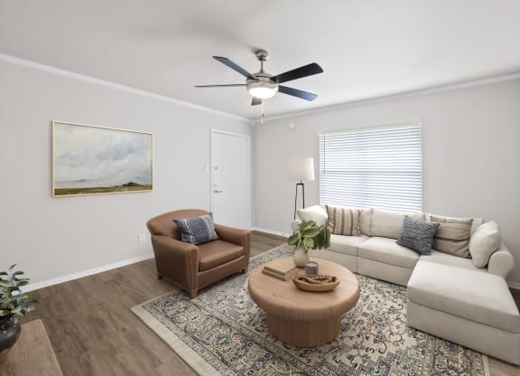a living room with a ceiling fan and a couch and chair  at Sunset Heights, San Antonio, TX, 78209