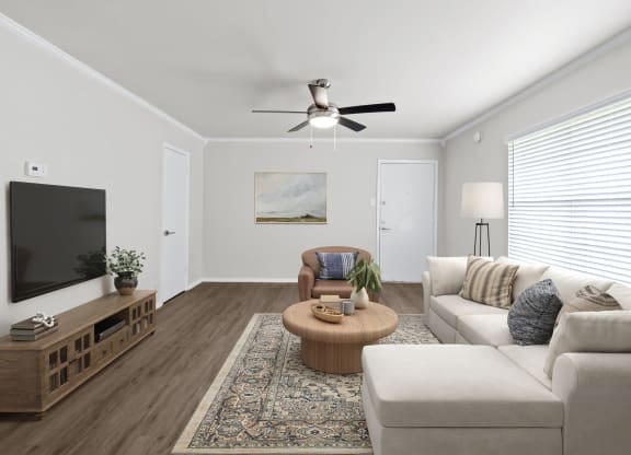 a living room with white walls and a large window  at Sunset Heights, San Antonio