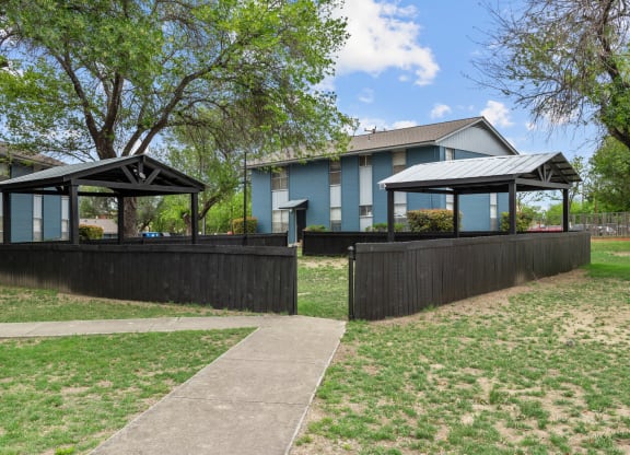 a house with a fence and two gazebos  at Sunset Heights, San Antonio, 78209