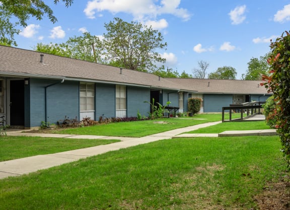 a blue building with a picnic table in front of it  at Sunset Heights, San Antonio, Texas