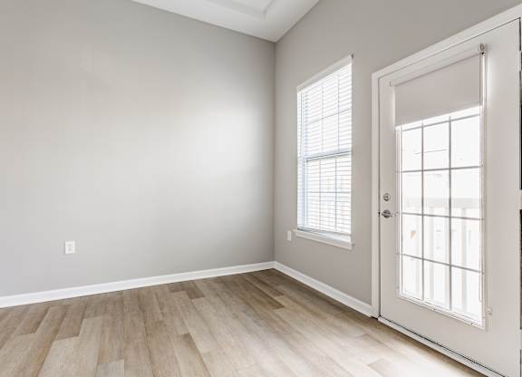 A room with a door and a window.