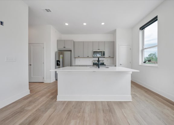 a kitchen with a large center island  at Luxe 360 on Centerpointe Apartments, Midlothian