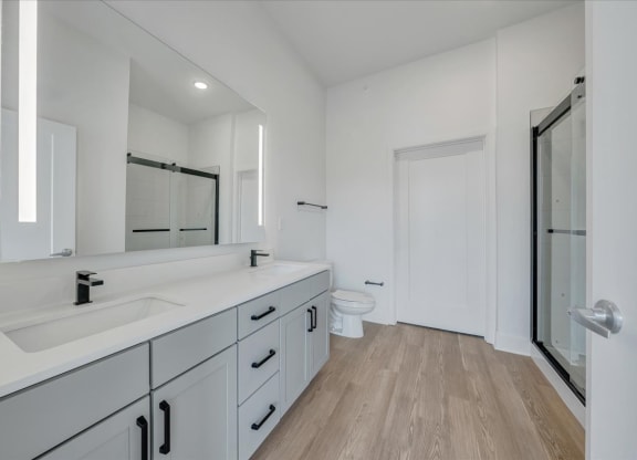 a bathroom with a sink and a toilet at Luxe 360 on Centerpointe Apartments, Midlothian, Virginia