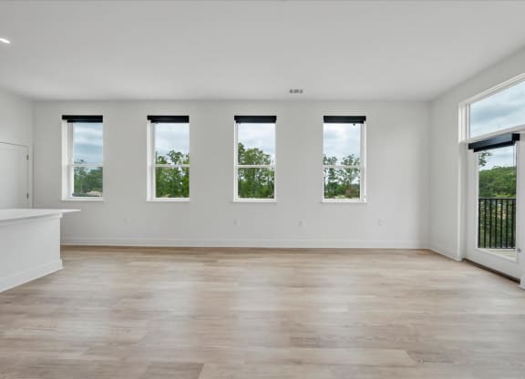 an empty living room at Luxe 360 on Centerpointe Apartments, Midlothian, VA