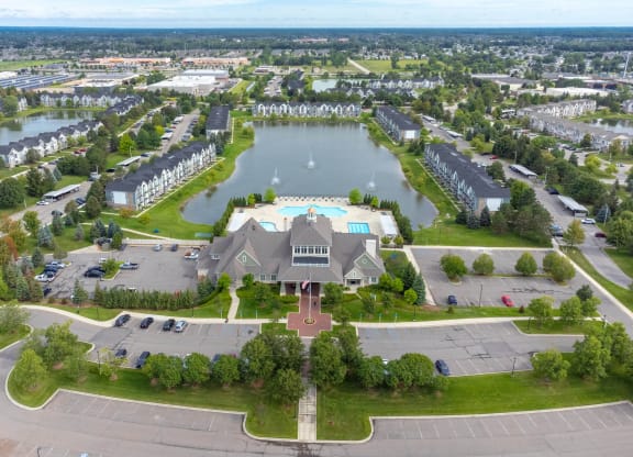 a mansion with a lake in the middle of itat The Harbours Apartments, Michigan