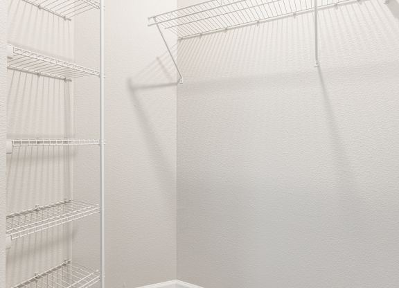 A white refrigerator with empty shelves.