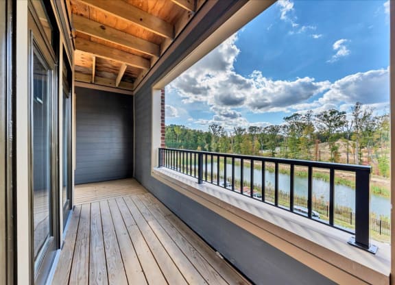 a balcony with a view of a body of water at Luxe 360 on Centerpointe Apartments, Midlothian, Virginia