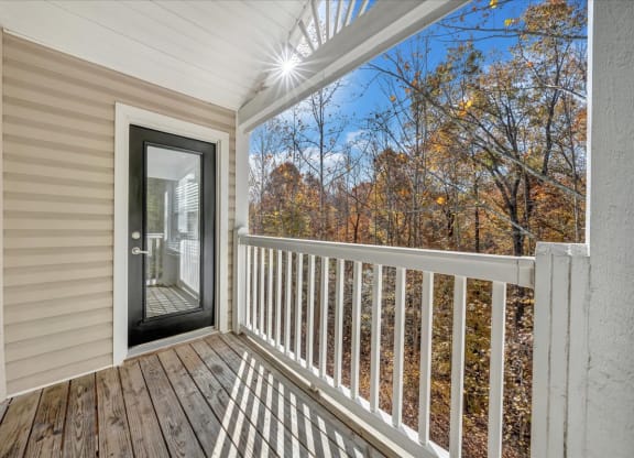 the deck of a home with a glass door to a porch at The Vinings Apartments in Richmond, VA 