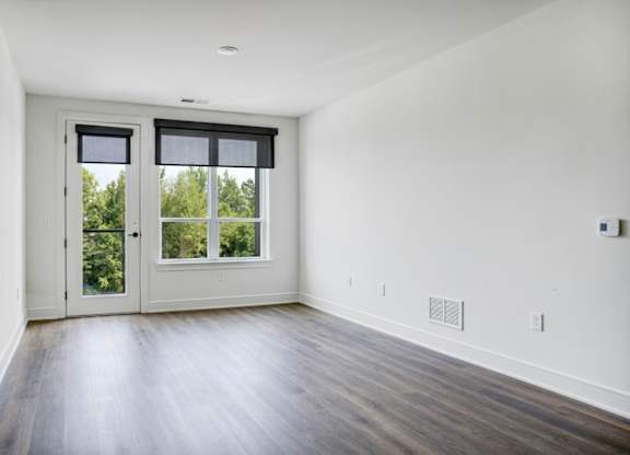 A room with a sliding door and a window.