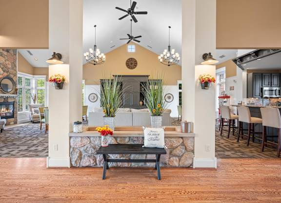 A room with a stone wall and a wooden floork at Timberlane Apartments, Peoria, Illinois