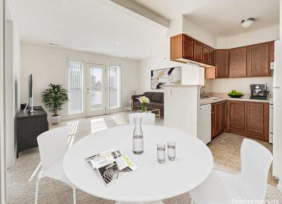 Buttercup Layout Model Dining Space with Kitchen View at The Harbours Apartments, Clinton Twp, MI 48038