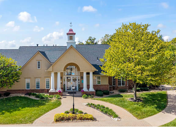 A house with a red roof and a white columned porch at Timberlane Apartments, Illinois, 61615